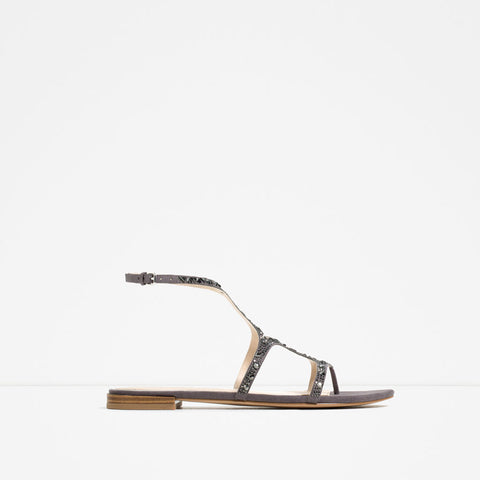 FLAT SANDALS WITH SHINY DETAILS